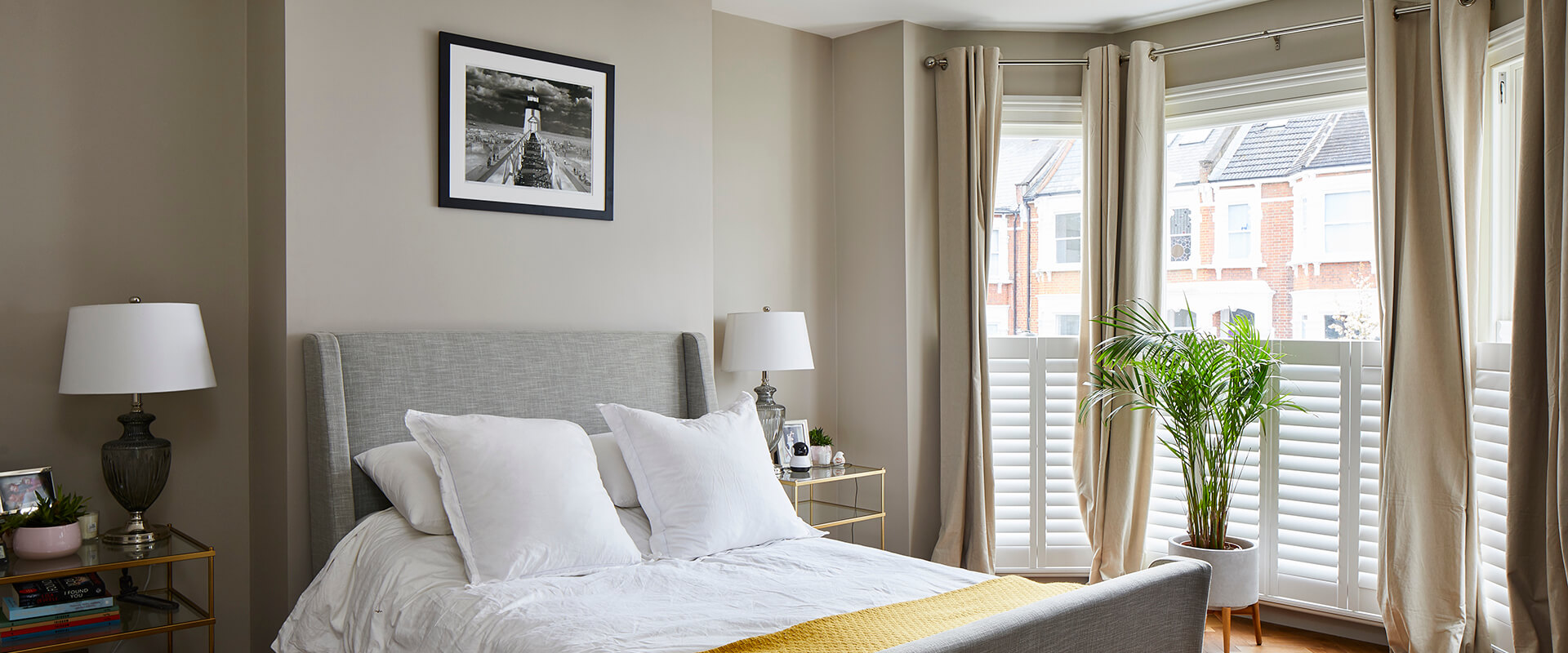 grey colored bedroom with victorian style windows