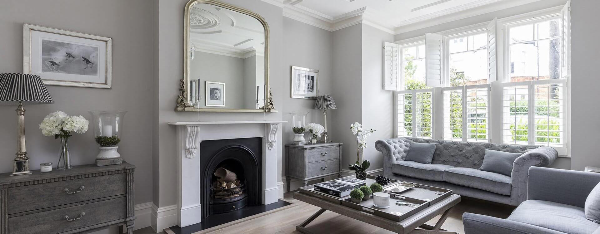 grey sitting area with fire pit and sofas