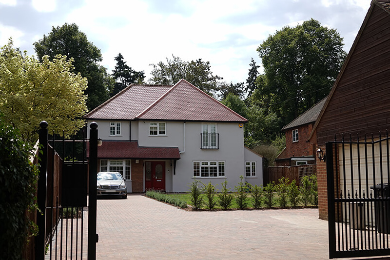 Large private residential home with a driveway