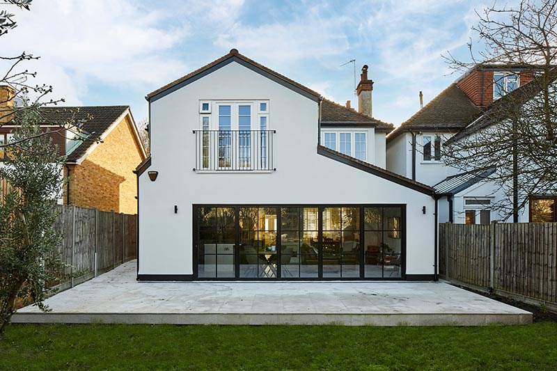 rear white house extension with bifold doors