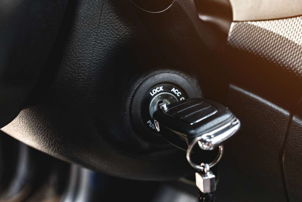 close up view of a car key in the ignition