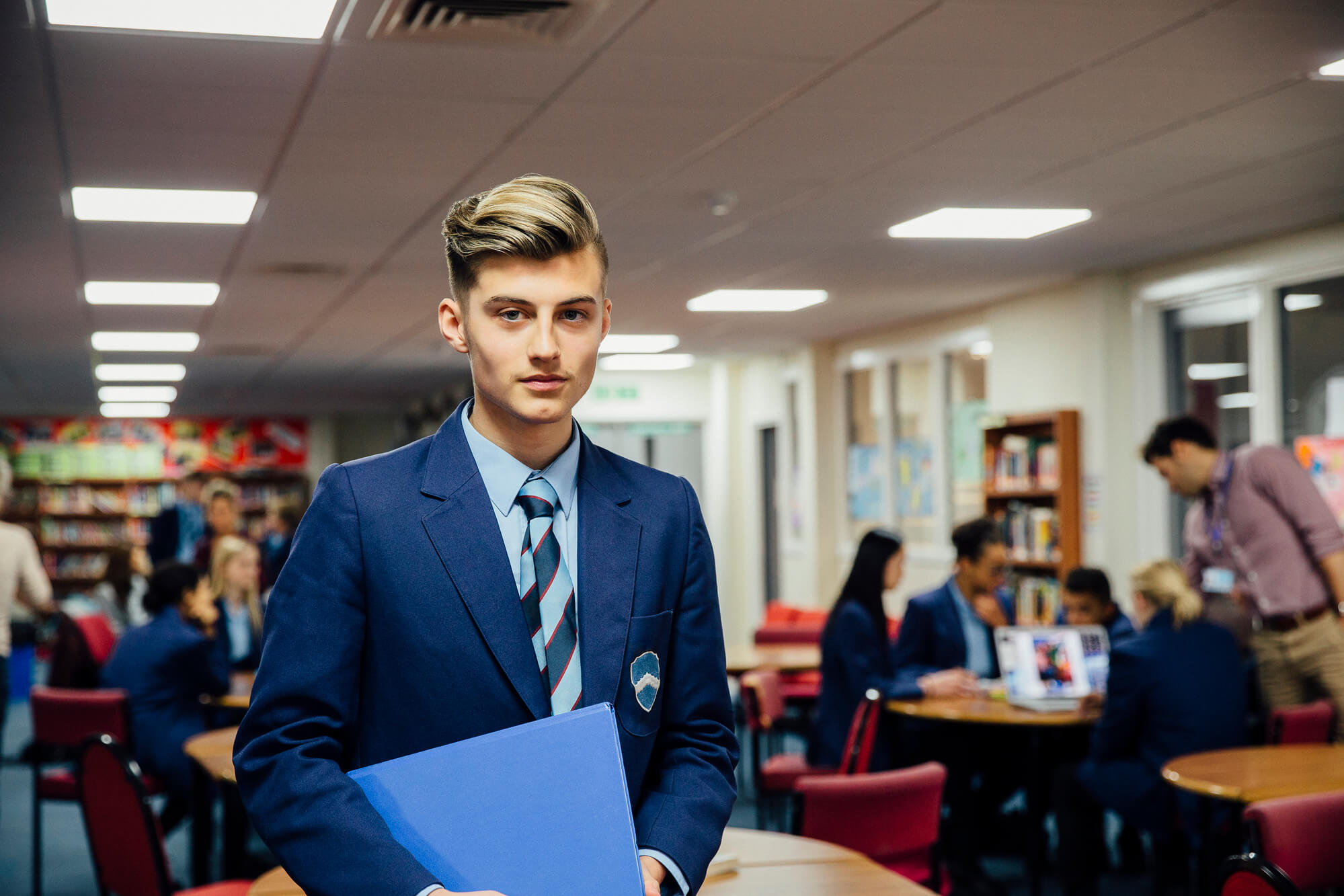 high school boy wearing a blue School uniform