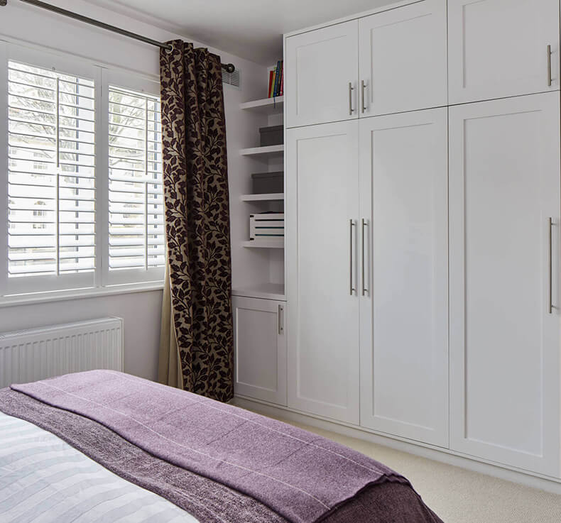 bedroom with white closet