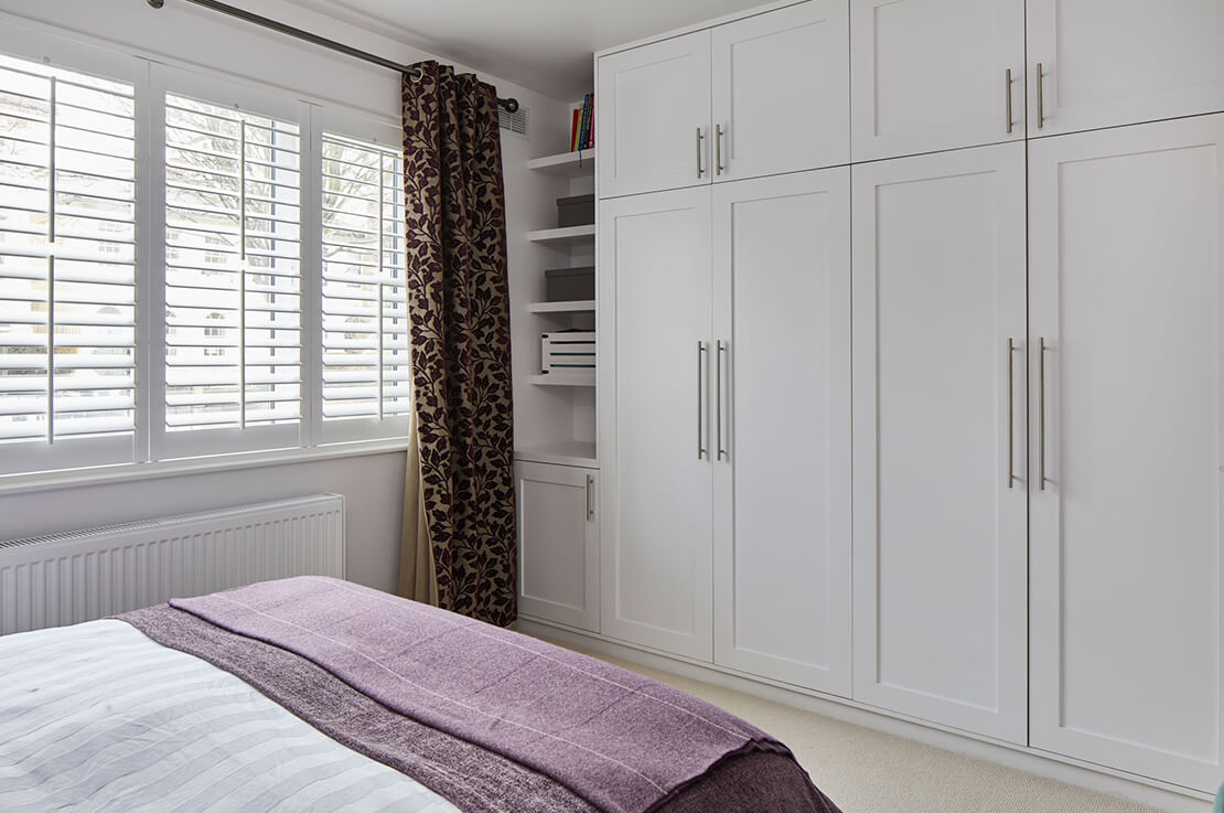bedroom with white closet