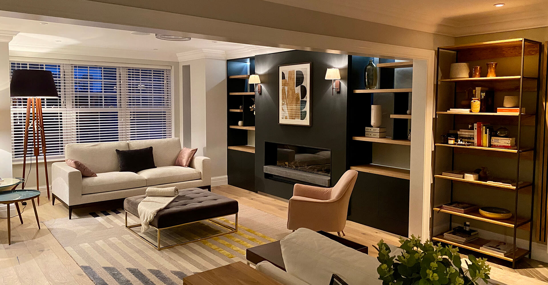 modern lounge room with sleek dark blue built-in display case and fireplace