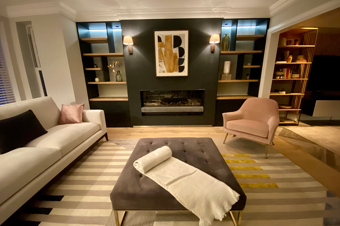 modern lounge with modern cushioned table, rug and fireplace