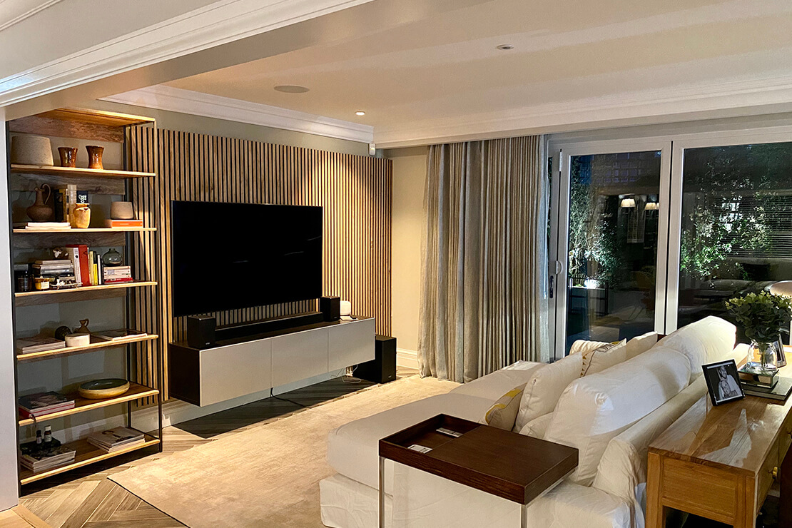 TV room with white sofa and sliding doors to patio 
