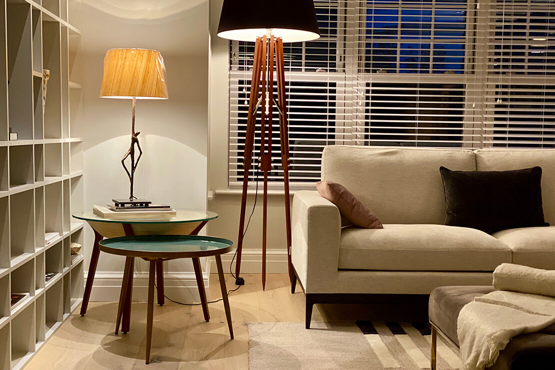 Table lamp next to a sofa in a grey living room