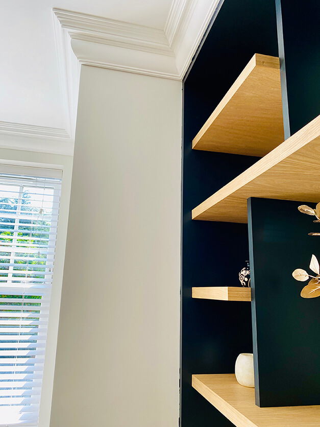 modern black and wooden alcove cabinets and louvre blinds