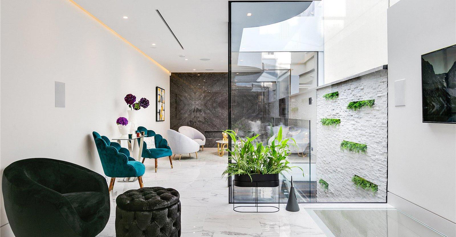 loft lounge area with modern black, teal and white armchairs