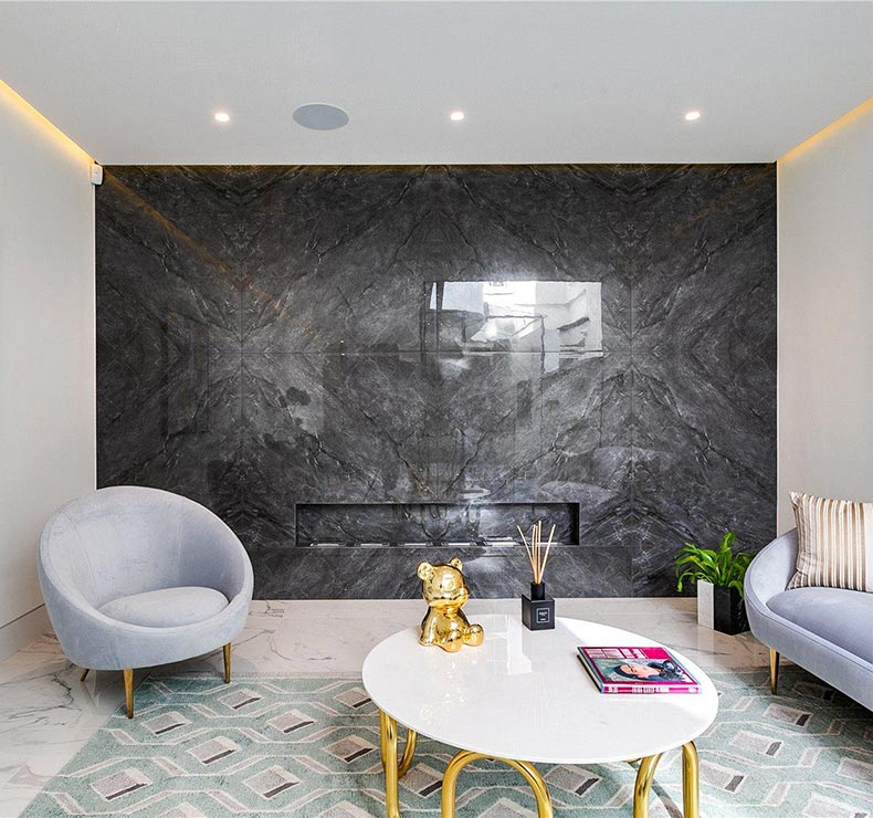 room with sofa, armchair and table