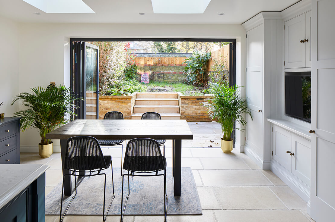 grey bifold doors in open plan kitchen living room