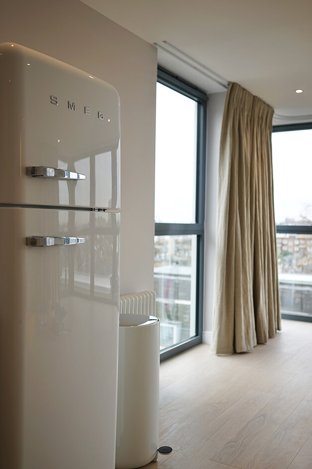 open plan kitchen and lounge room with wooden flooring