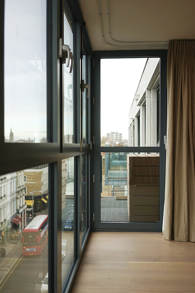 black paned glass door with city views