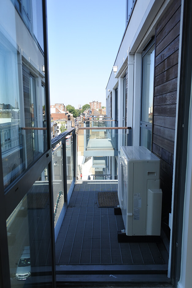 modern balcony with glass balustrades and city views 