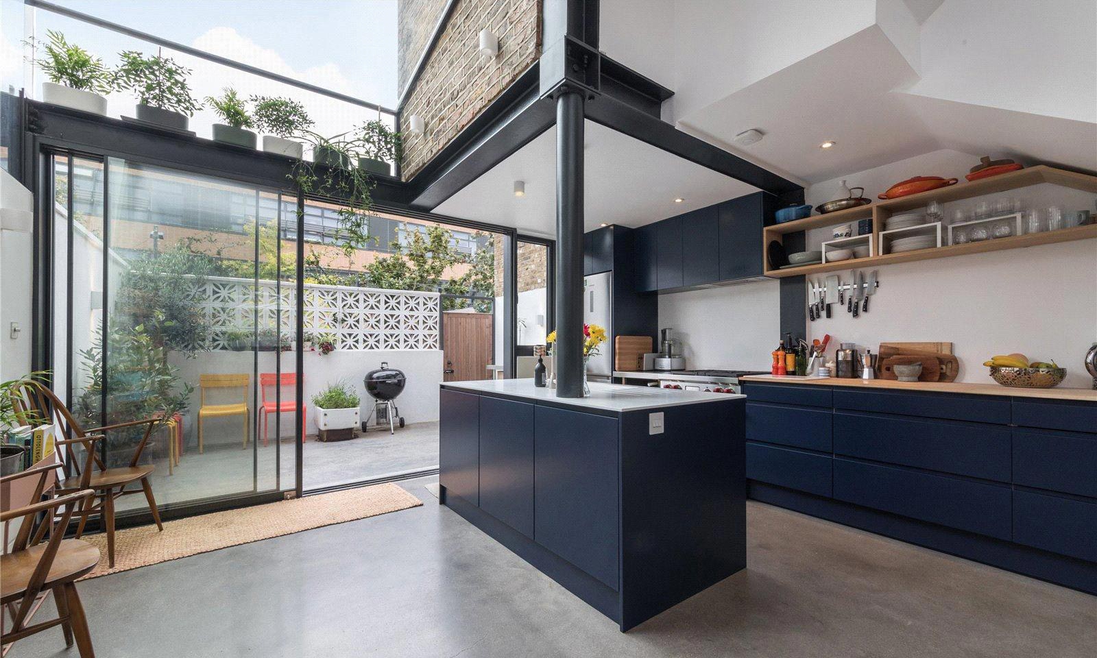 blue kitchen with glass door and ceiling