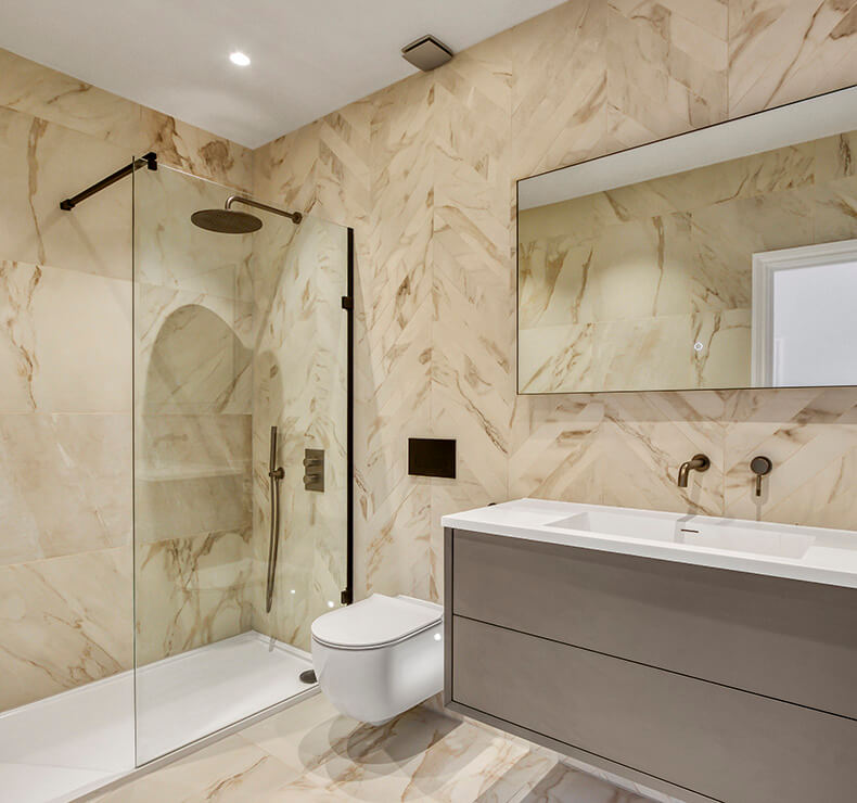 Modern domestic bathroom design with elegant beige, brown, and white fixtures and furnishings