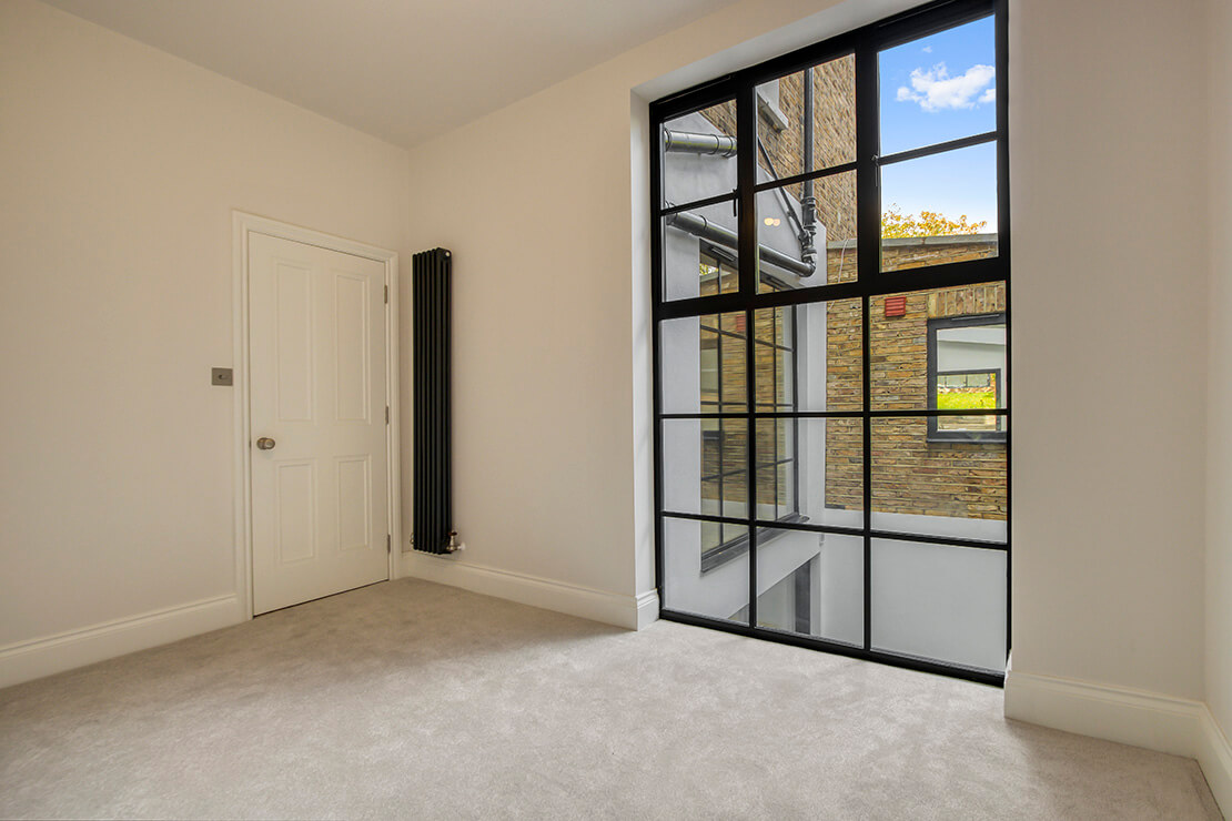 Modern room interior Ddesign with light taupe and dark tan flooring.