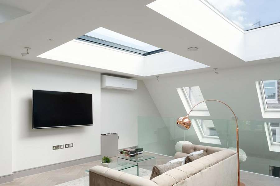 large open plan loft conversion with velux windows and glass partitions