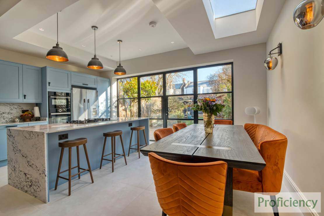 kitchen table with orange fabric chairs