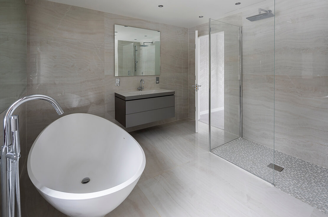modern bathroom, sink with cabinet and mirror, and door shower