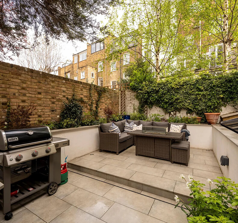 patio with bbq and grey garden seating