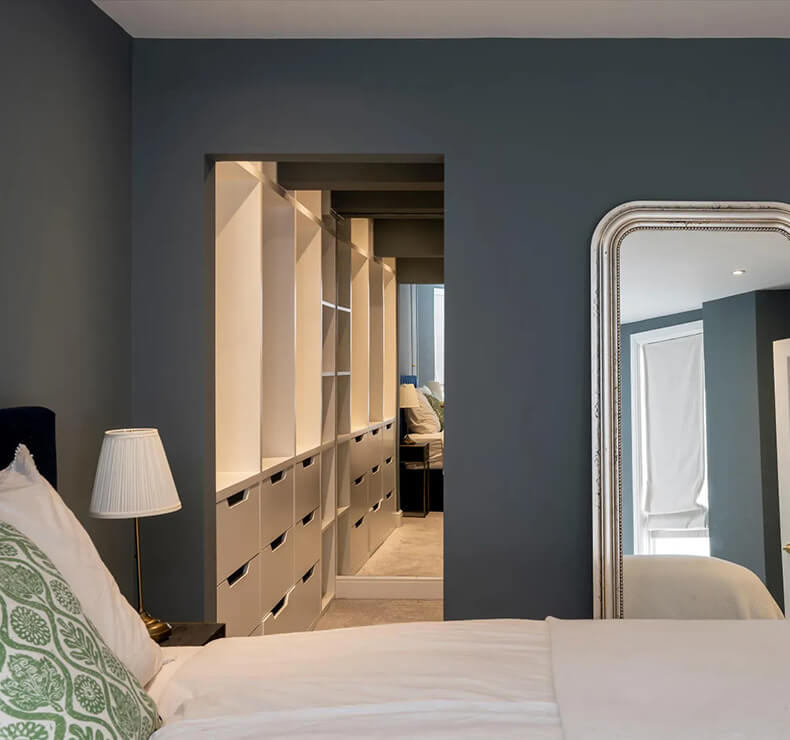 entrance to dark grey walk in wardrobe