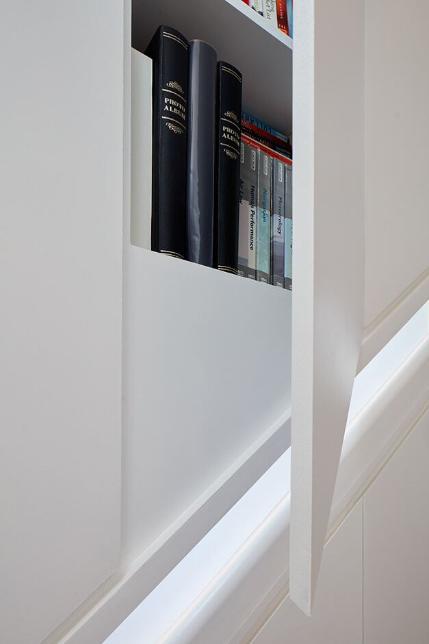 built-in book case with modern white doors