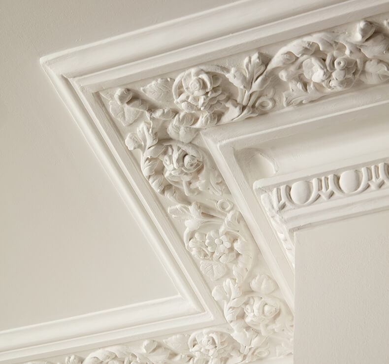 white ceiling with cornice with floral detail