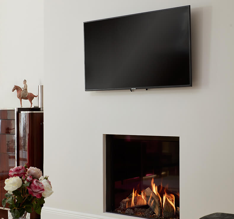 modern hole in wall fireplace with suspended TV