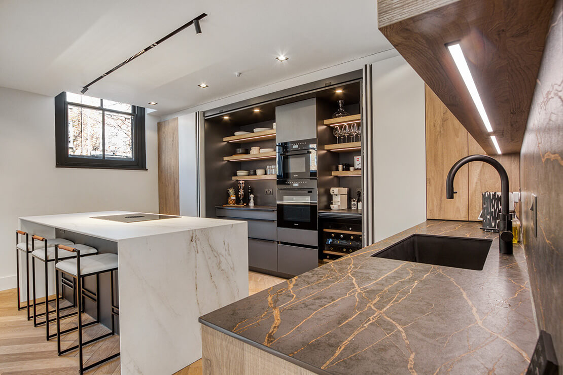 open plan room with ceiling spot light and linear led pendant