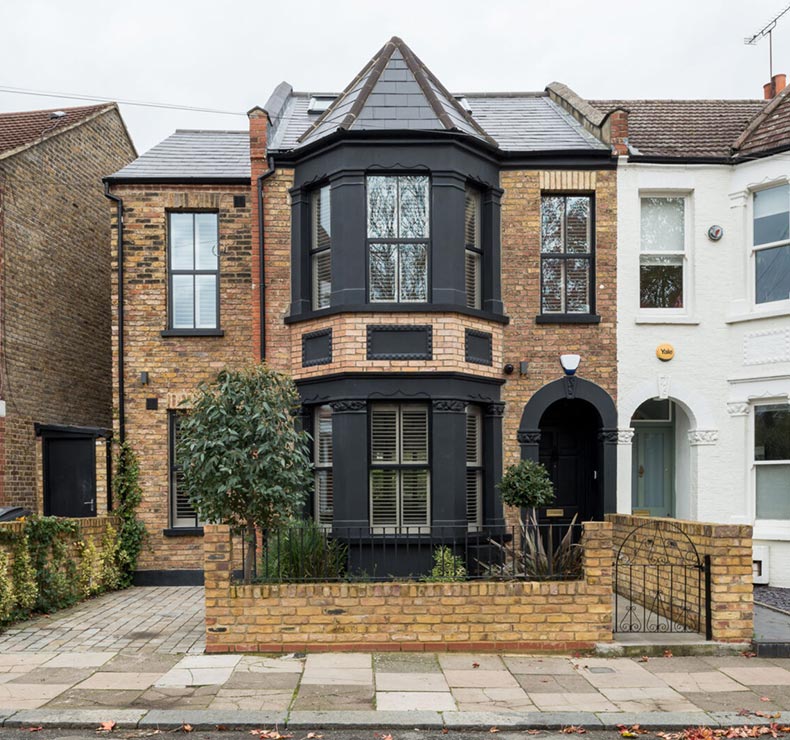 multi storey extension with exposed brick wall