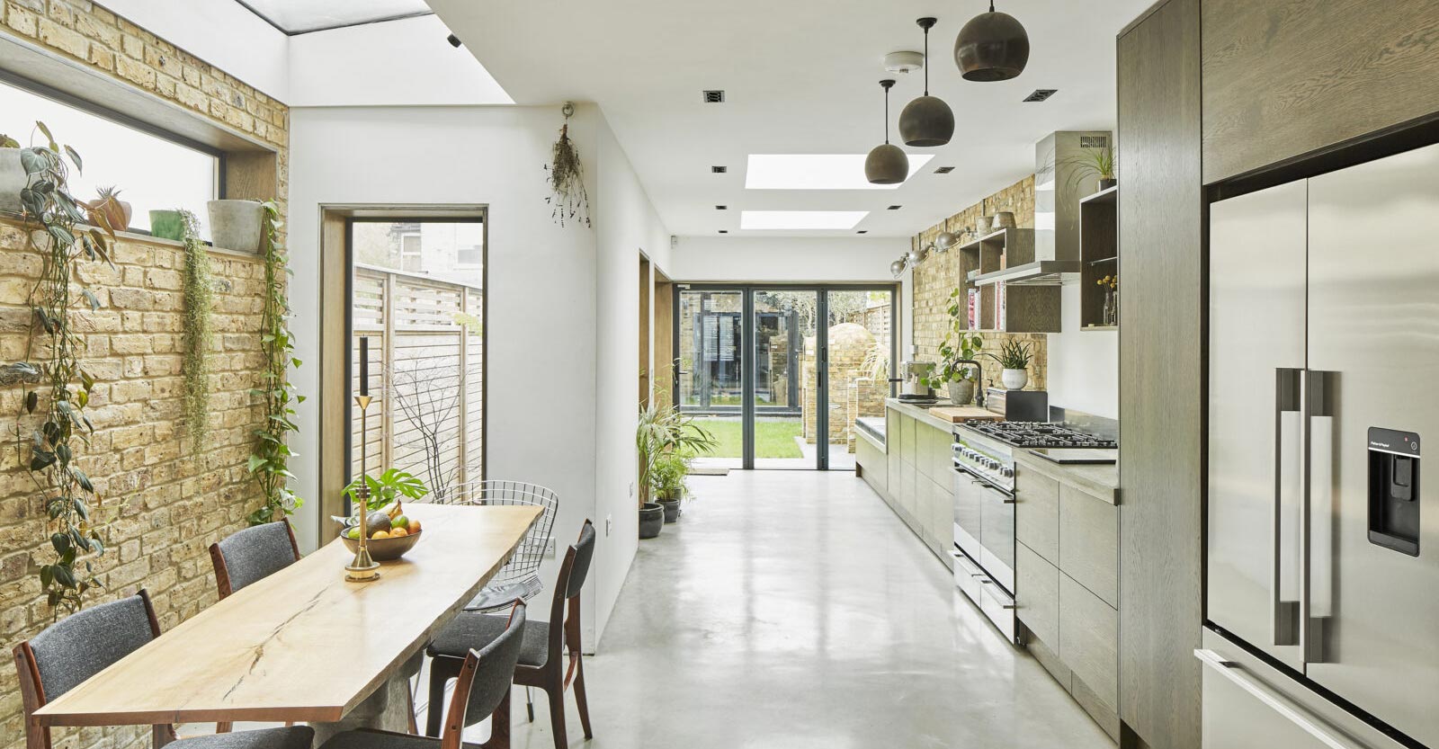 house extensions with exposed brick wall in conservation area