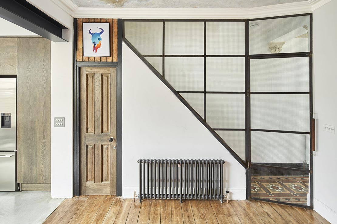 contemporary living room with exposed metal beams