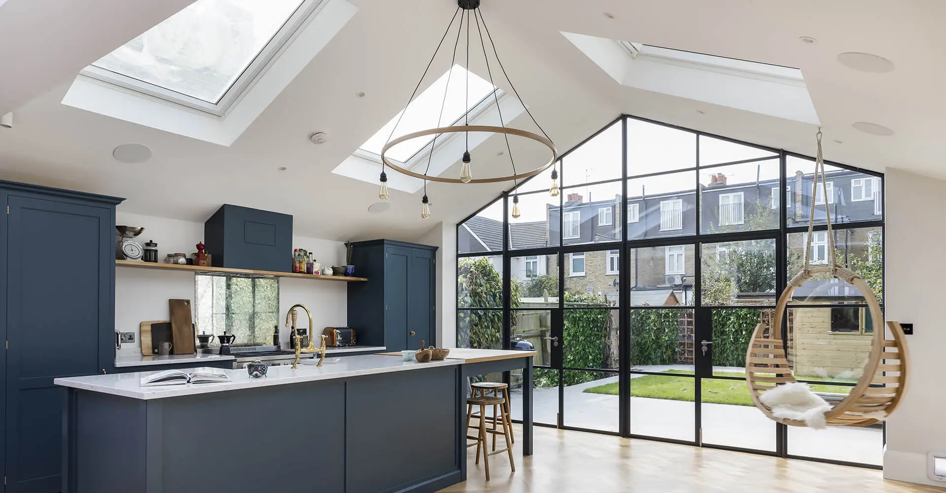 blue kitchen island with sink and breakfast bar