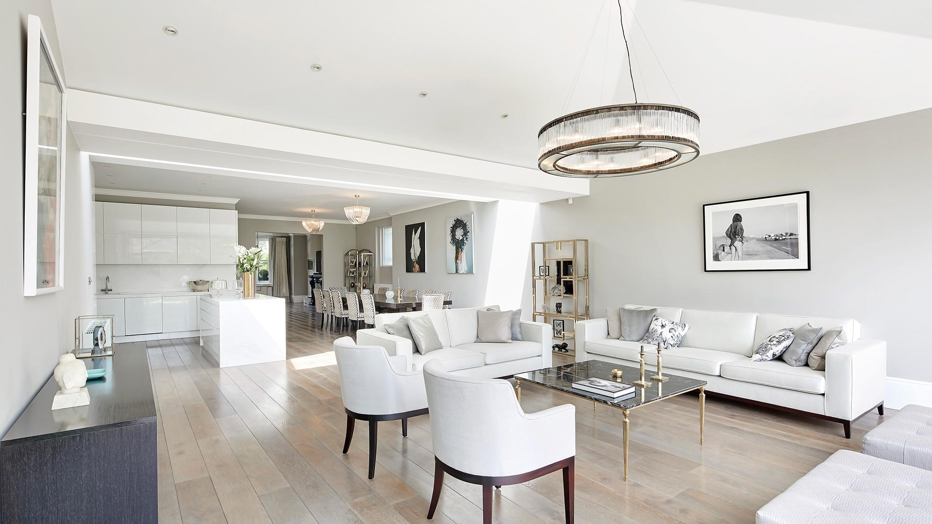 white open plan living room with bifold doors