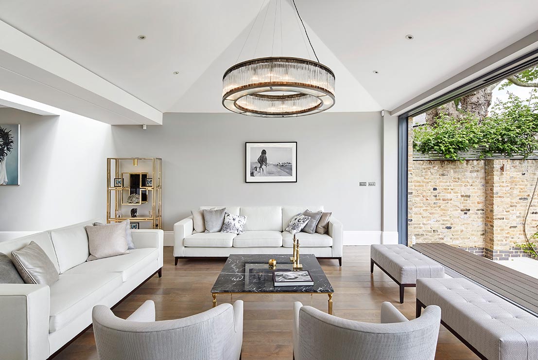 spacious open plan kitchen living room with open bifold doors