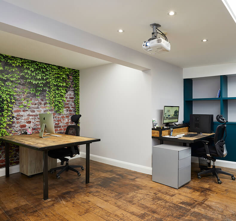 office with hanging projector, white walls and wooden floors