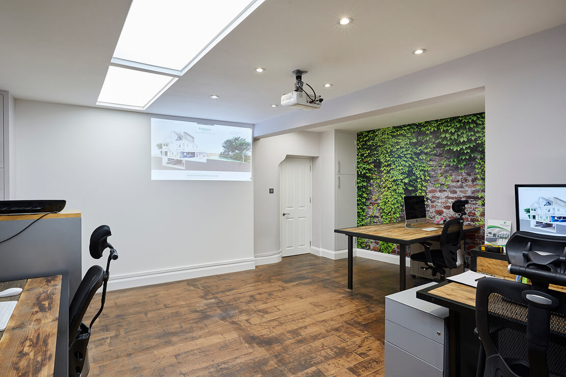 large office space with artificial skylight and hanging projector