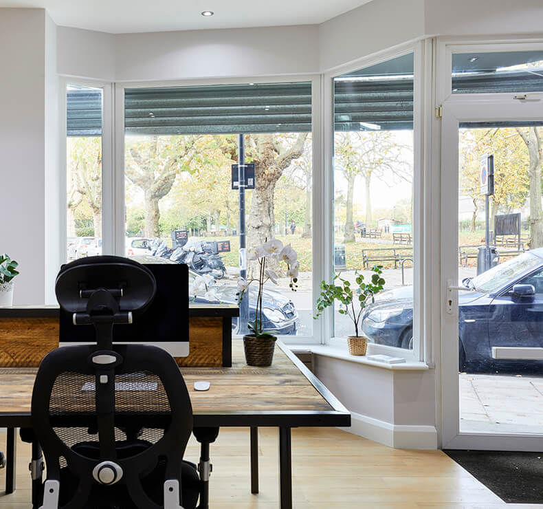 city office space with large floor length windows and outside view