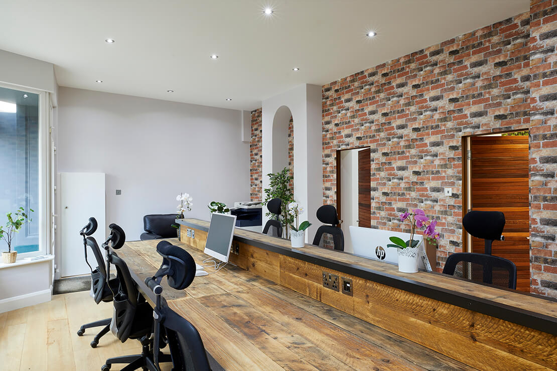 red brick interior walls in modern office with wooden doors