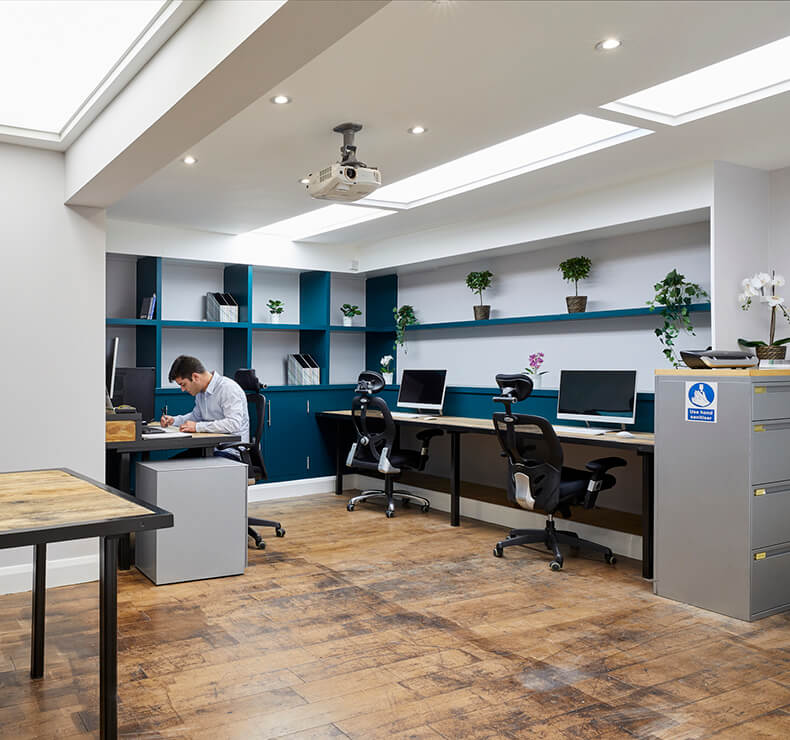 modern office with wooden floors and blue display cabinets