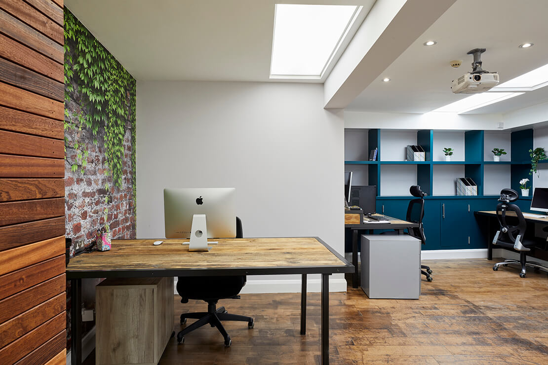 modern office with wood panneling, wooden flooring and red brick wallpaper 
