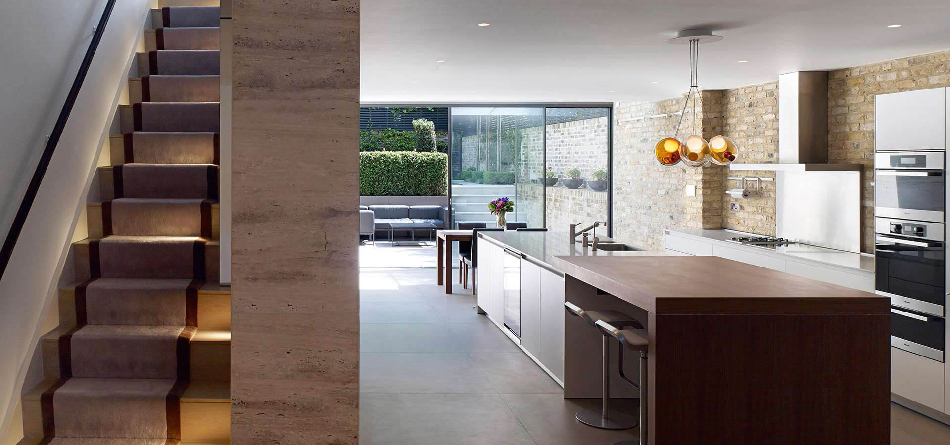 Basement kitchen conversion with exposed bricks and modern fittings